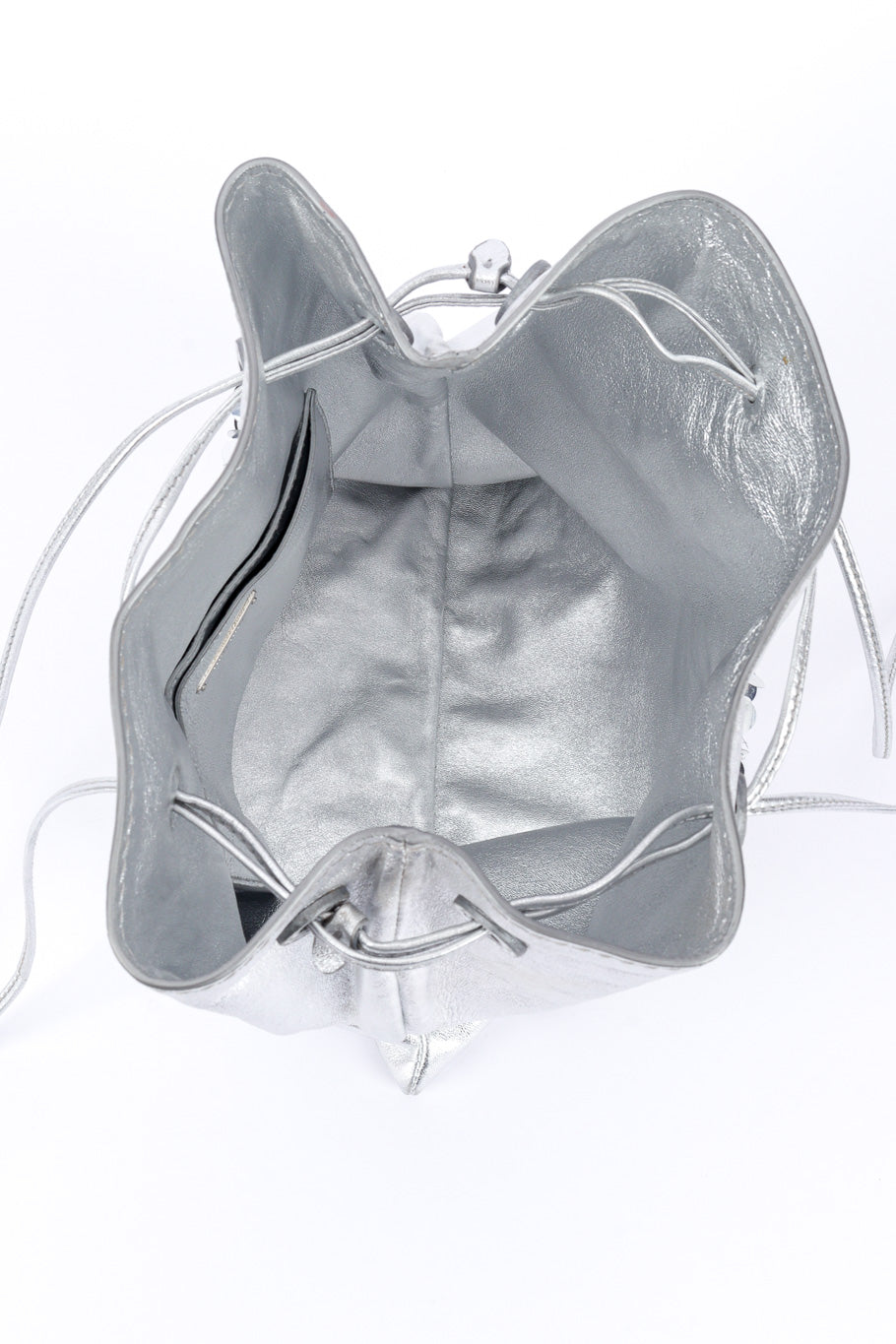 Miu Miu Metallic Drawstring Bag open bag inner view on white backdrop @Recessla