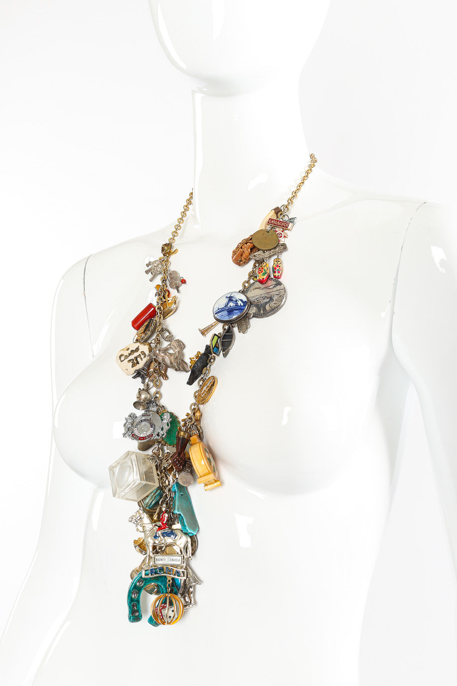 Charm necklace by Monet on white background on mannequin side angle @recessla