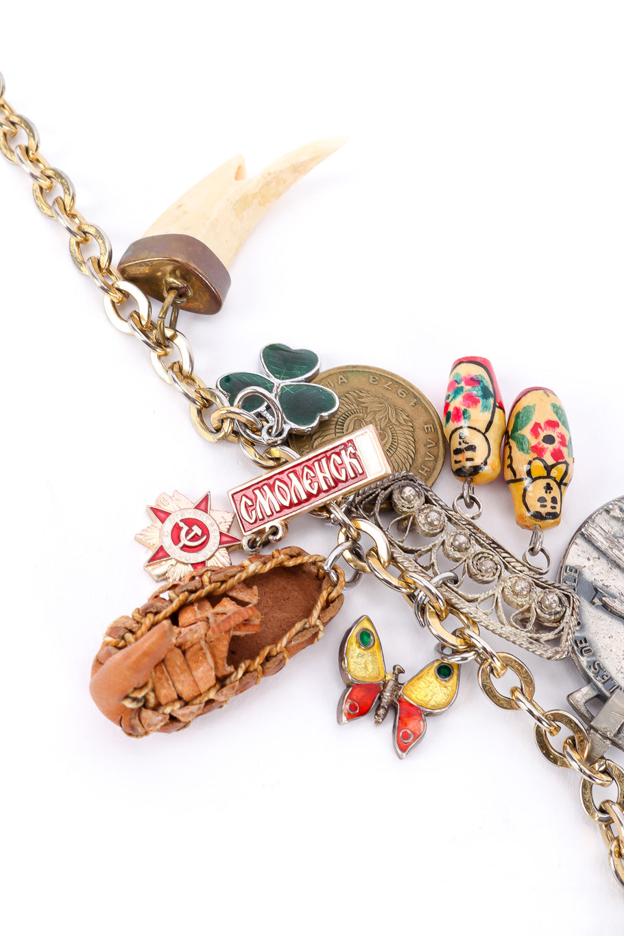 Charm necklace by Monet on white background leather shoe tooth and assorted charms @recessla