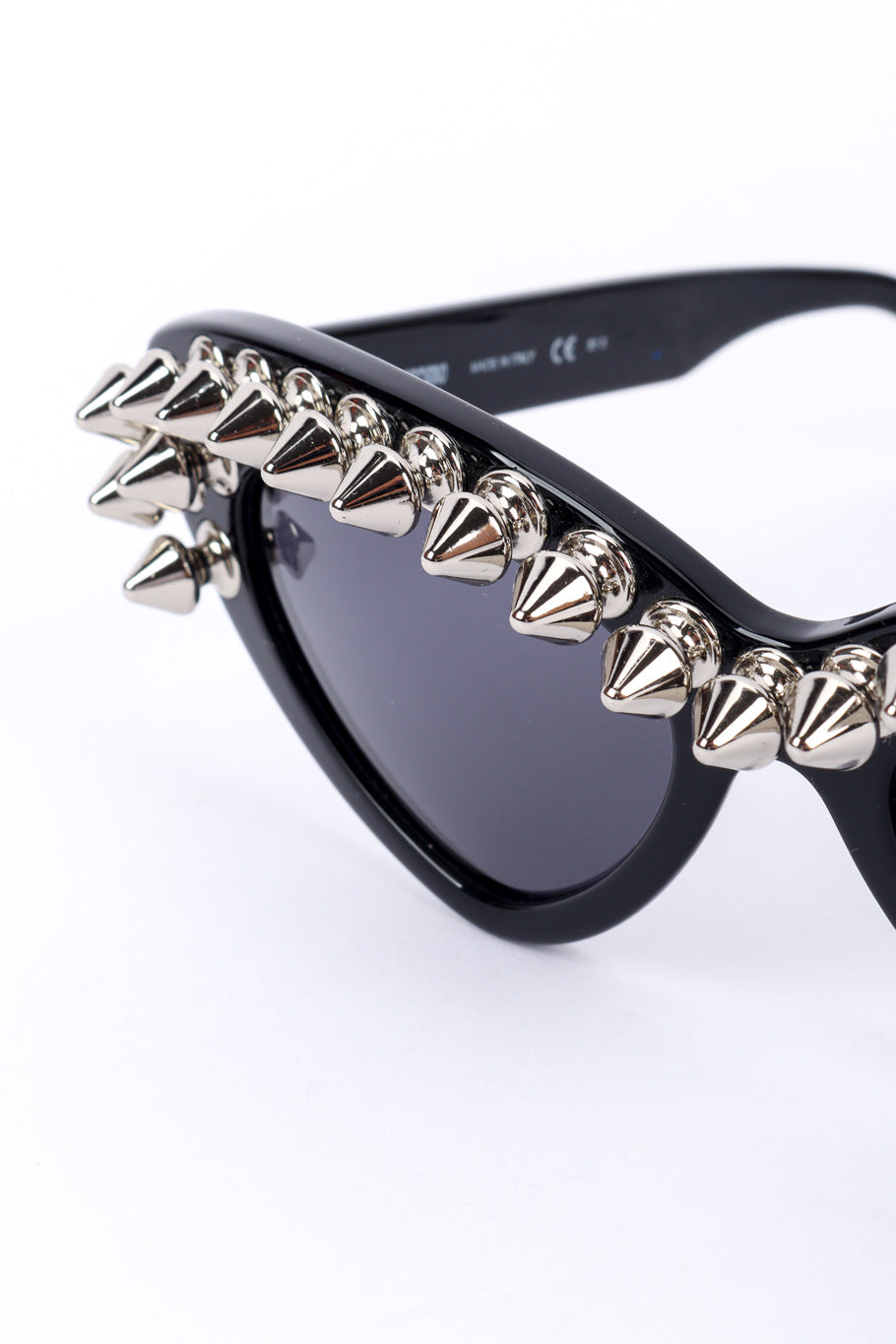 Spiked sunglasses by Moschino on white background spikes close @recessla