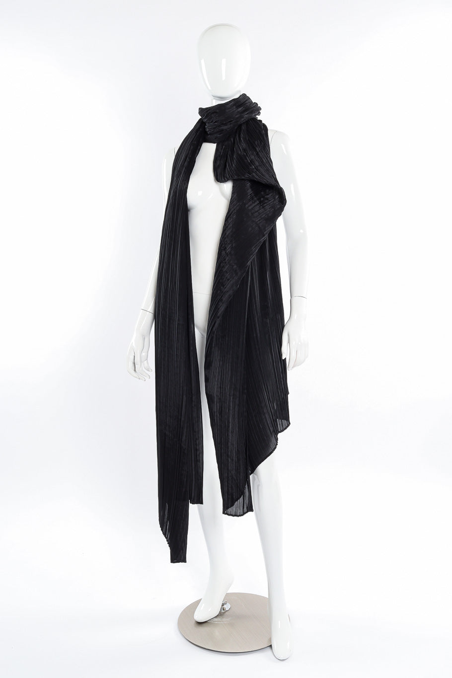 Pleats Please Issey Miyake Pleated Multi-Wrap Poncho II wrapped as a scarf on mannequin front view @Recessla