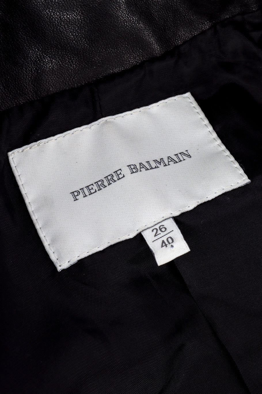 Pierre Balmain Ribbed Leather Moto Jacket signature label closeup @Recessla