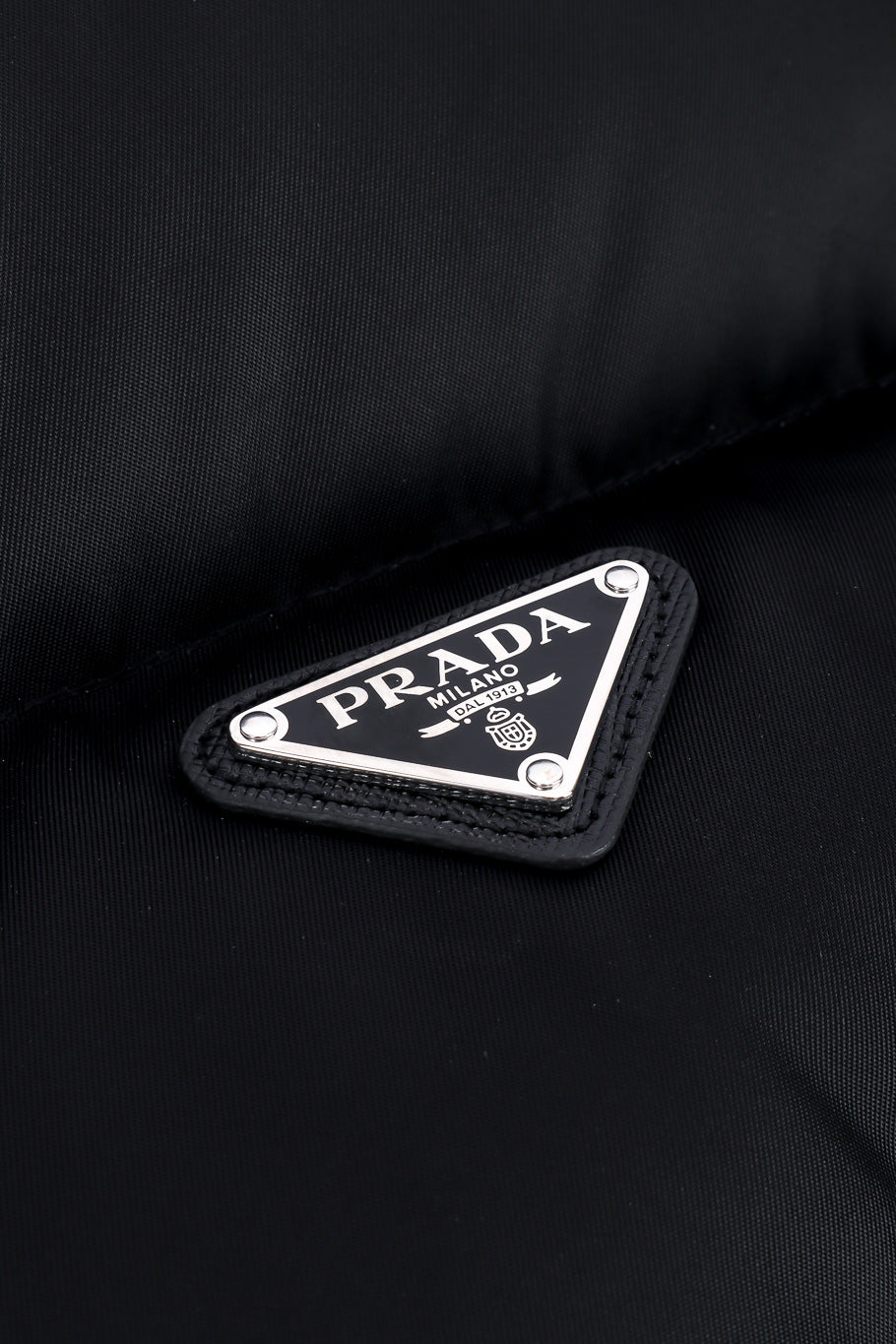 Prada Re-nylon Cropped Puffer Vest enamel triangle with logo closeup @Recessla