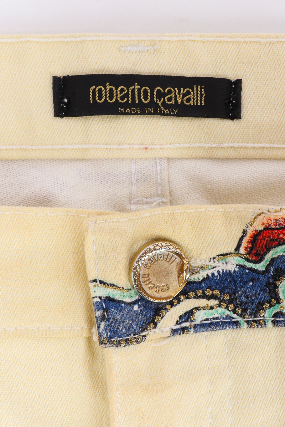 Vintage Roberto Cavalli Tattoo Graphic Denim Pants signature label and engraved front button closeup @Recessla