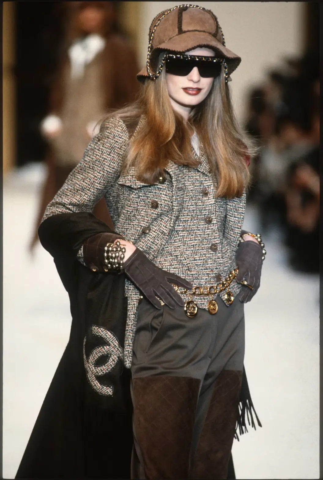 Coin charm belt by Chanel charms on runway on model 