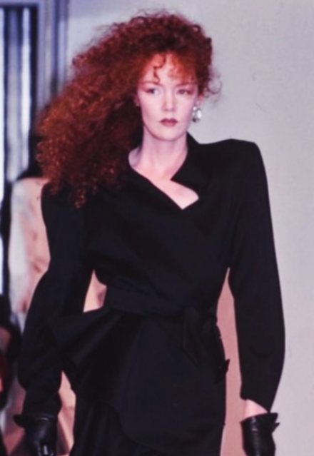 Asymmetrical Wrap Dress by Thierry Mugler similar cut jacket on model on runway