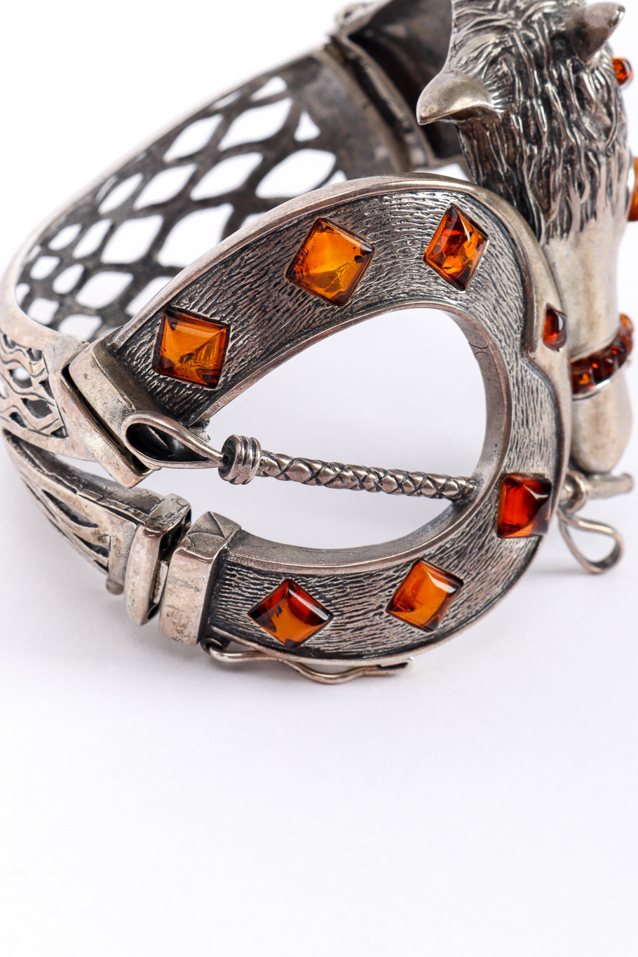 Vintage Equestrian Motif Magnet Bracelet horseshoe with glass beads closeup on a white backdrop @Recessla
