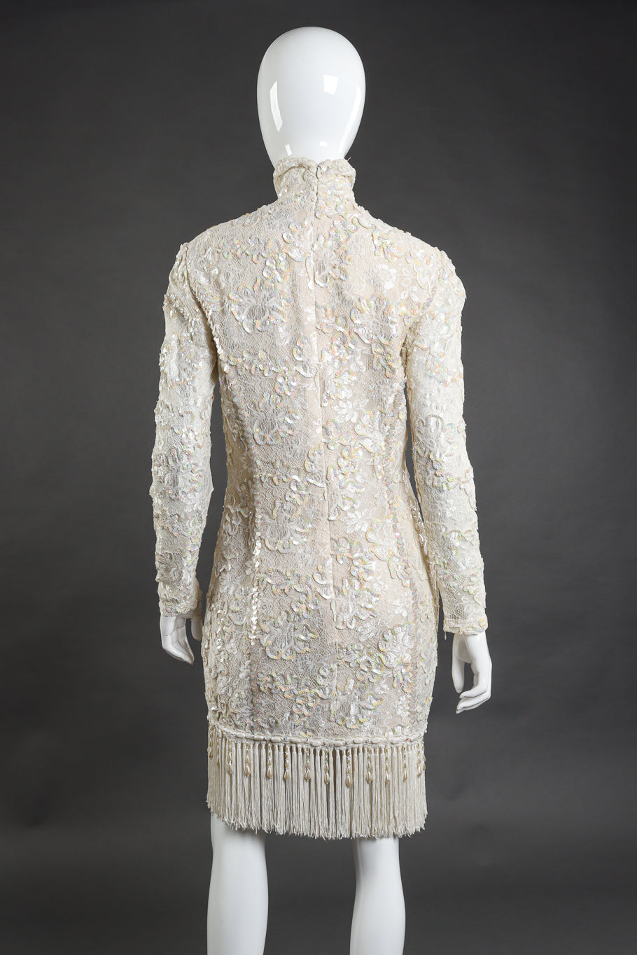 Vintage Ungaro cream lace, sequin, beading and fringe cocktail dress back view on mannequin @Recess LA