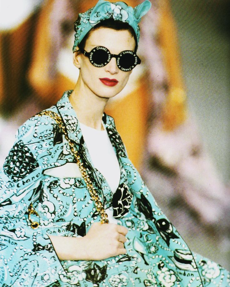 Round logo sunglasses by Chanel on model close on runway