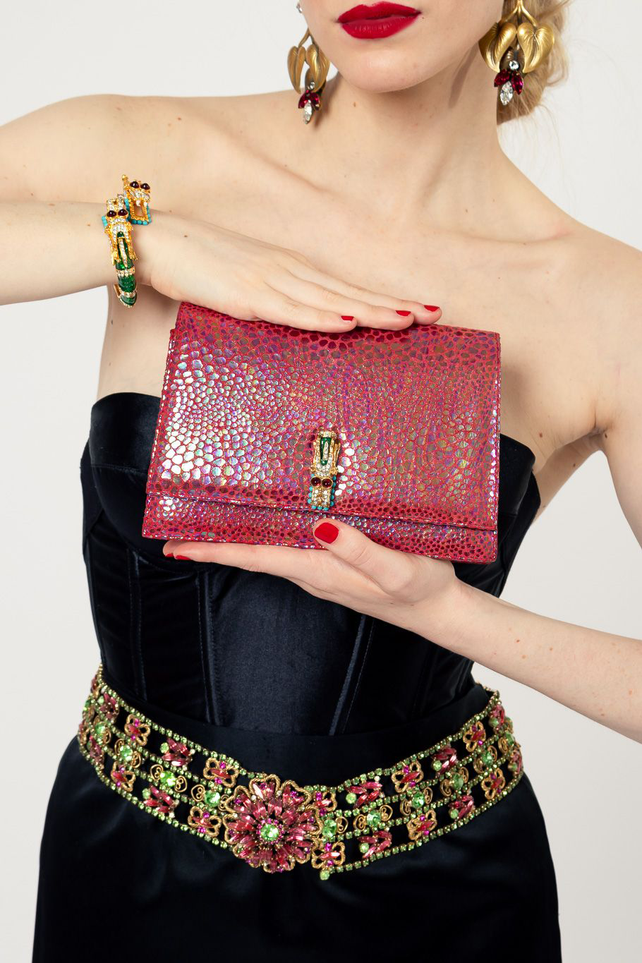 Clutch bag by Kenneth Jay Lane on white background held by model  @recessla