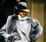 Vintage Saint Laurent double breasted blazer on model on 1981 runway with hat