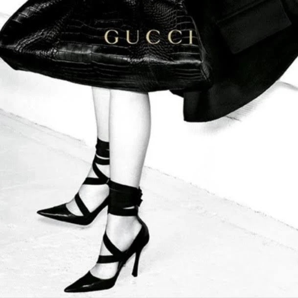 tie pumps by Gucci on model legs in 2002 ad