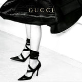tie pumps by Gucci on model legs in 2002 ad