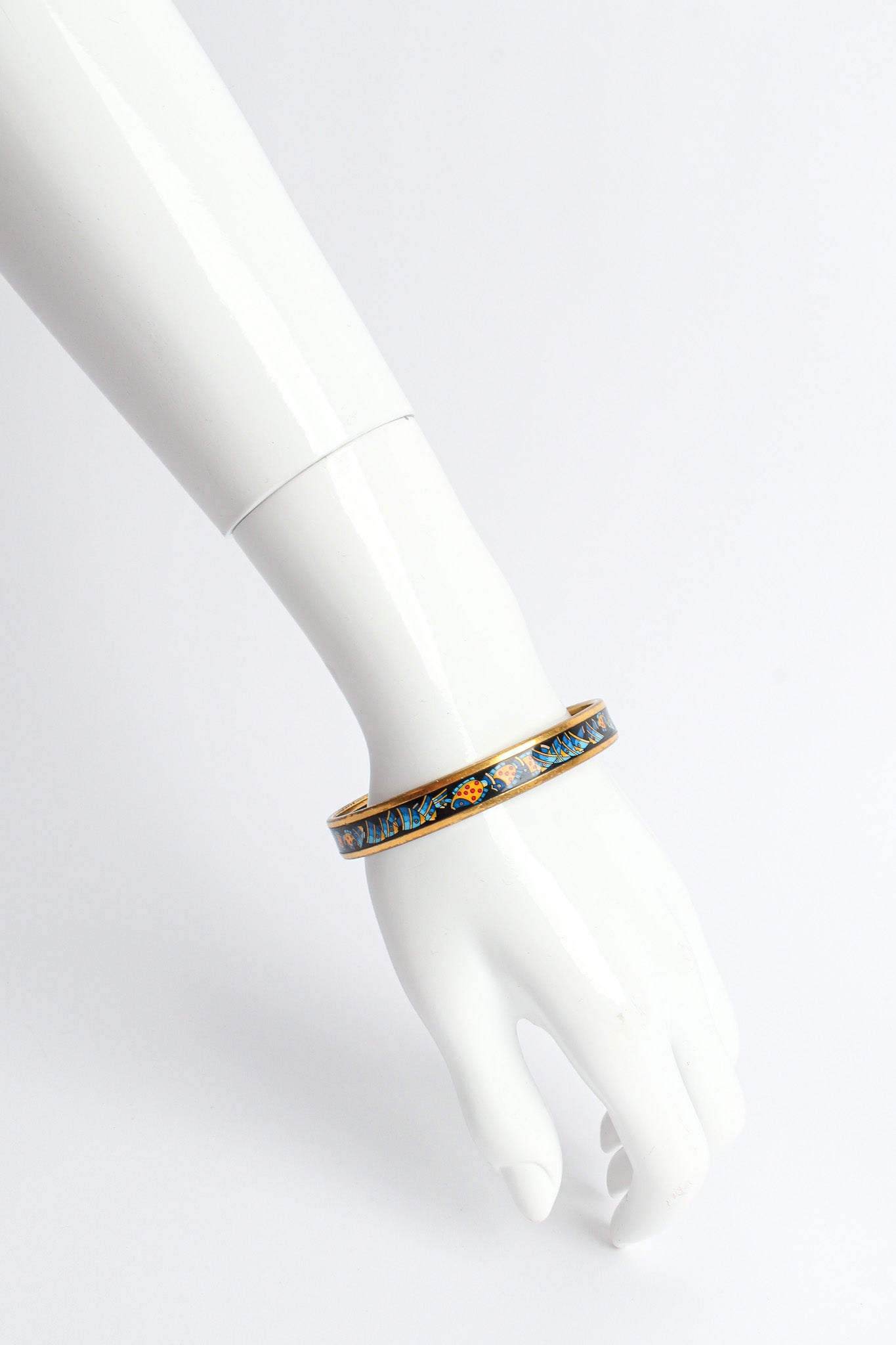 Vintage Hermés Tropical Fish Narrow Enamel Bracelet on mannequin wrist @ Recess LA
