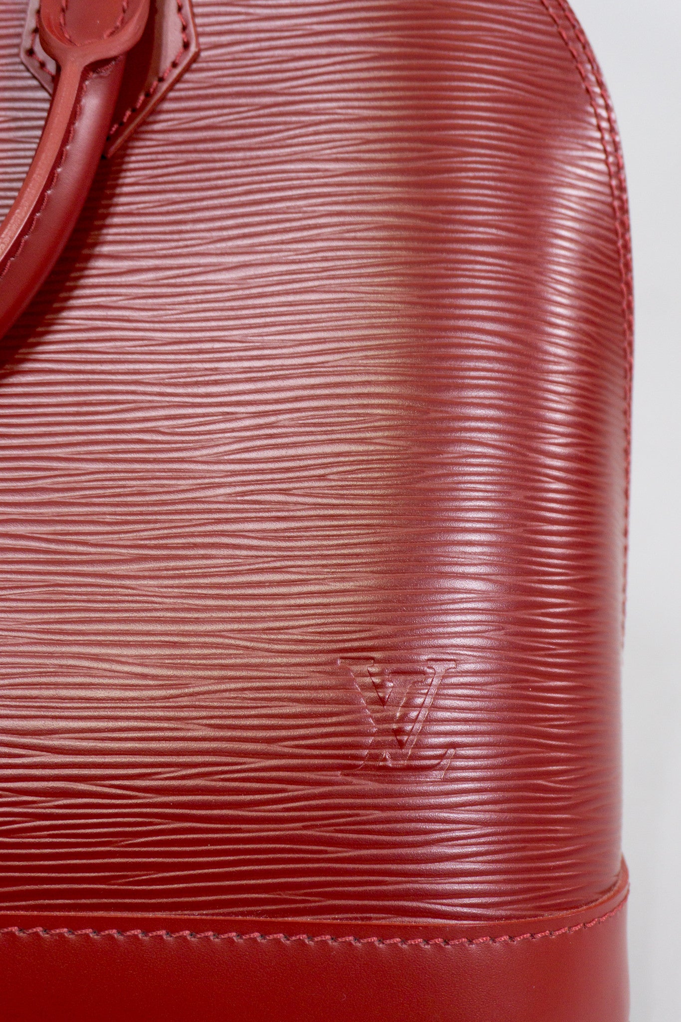 Louis Vuitton Epi Alma NM Handbag in Rubis Red