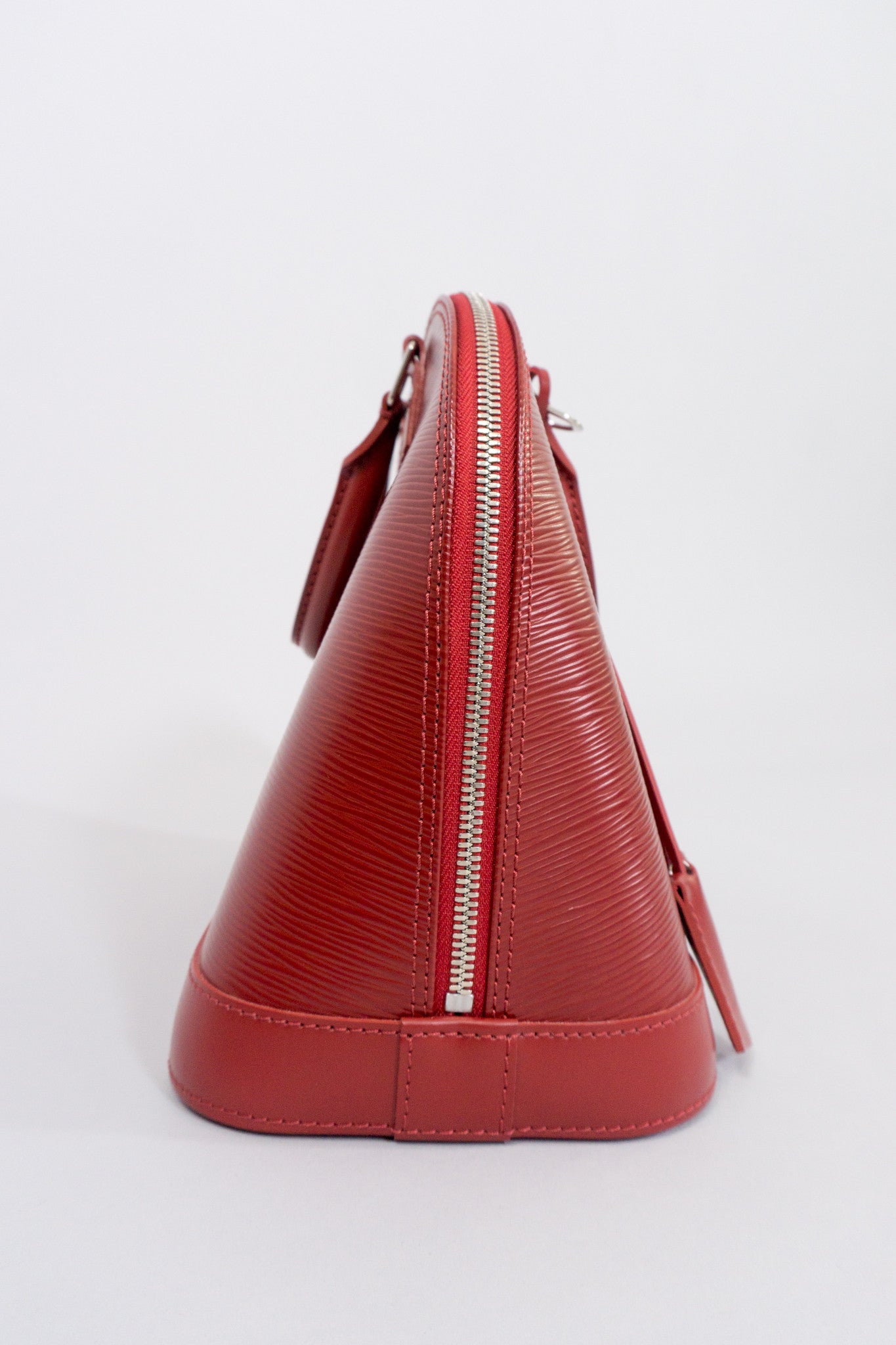 Louis Vuitton Epi Alma NM Handbag in Rubis Red