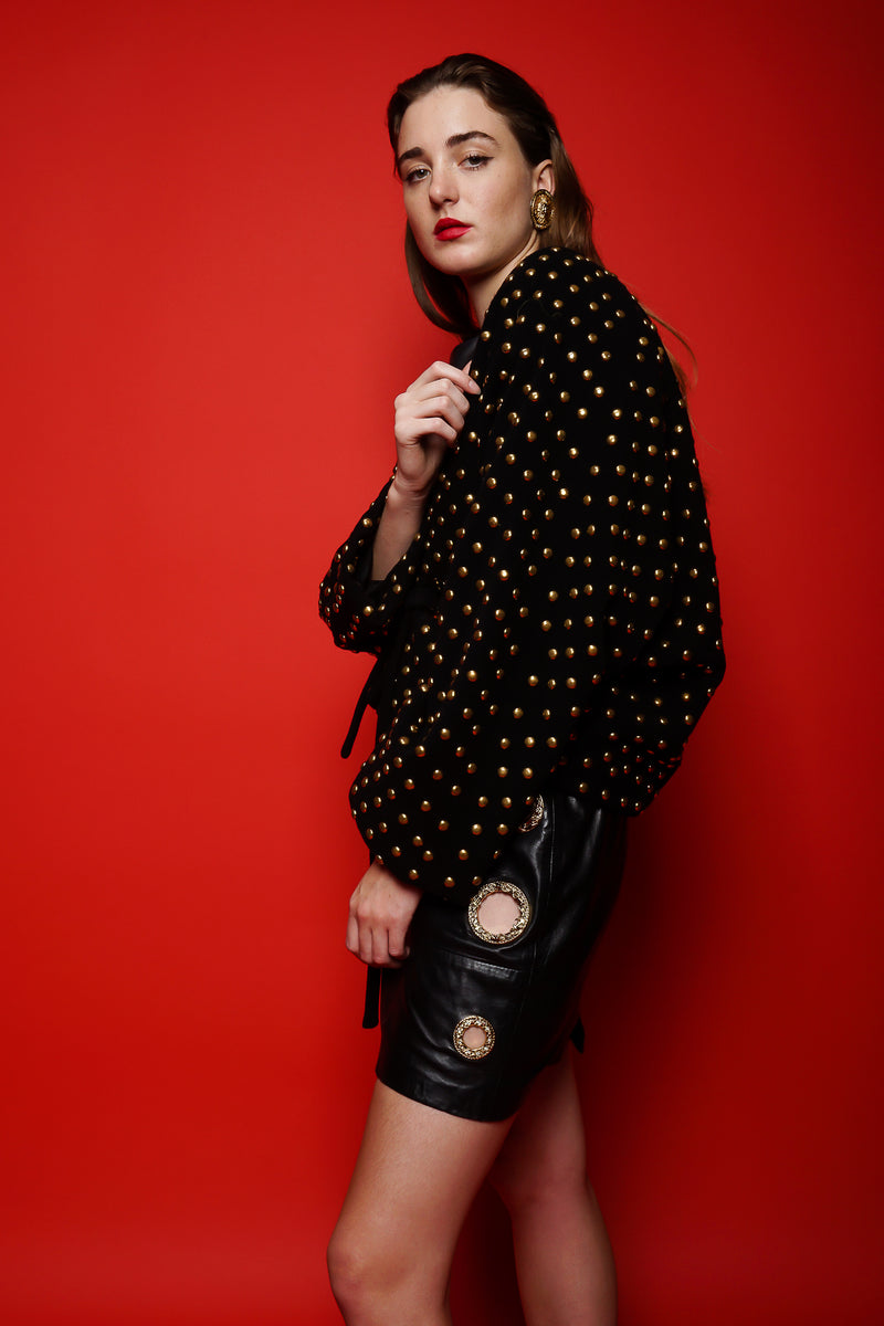 girl in Vintage Anne Klein Studded Dolman Tie Jacket on red background at Recess Los Angeles