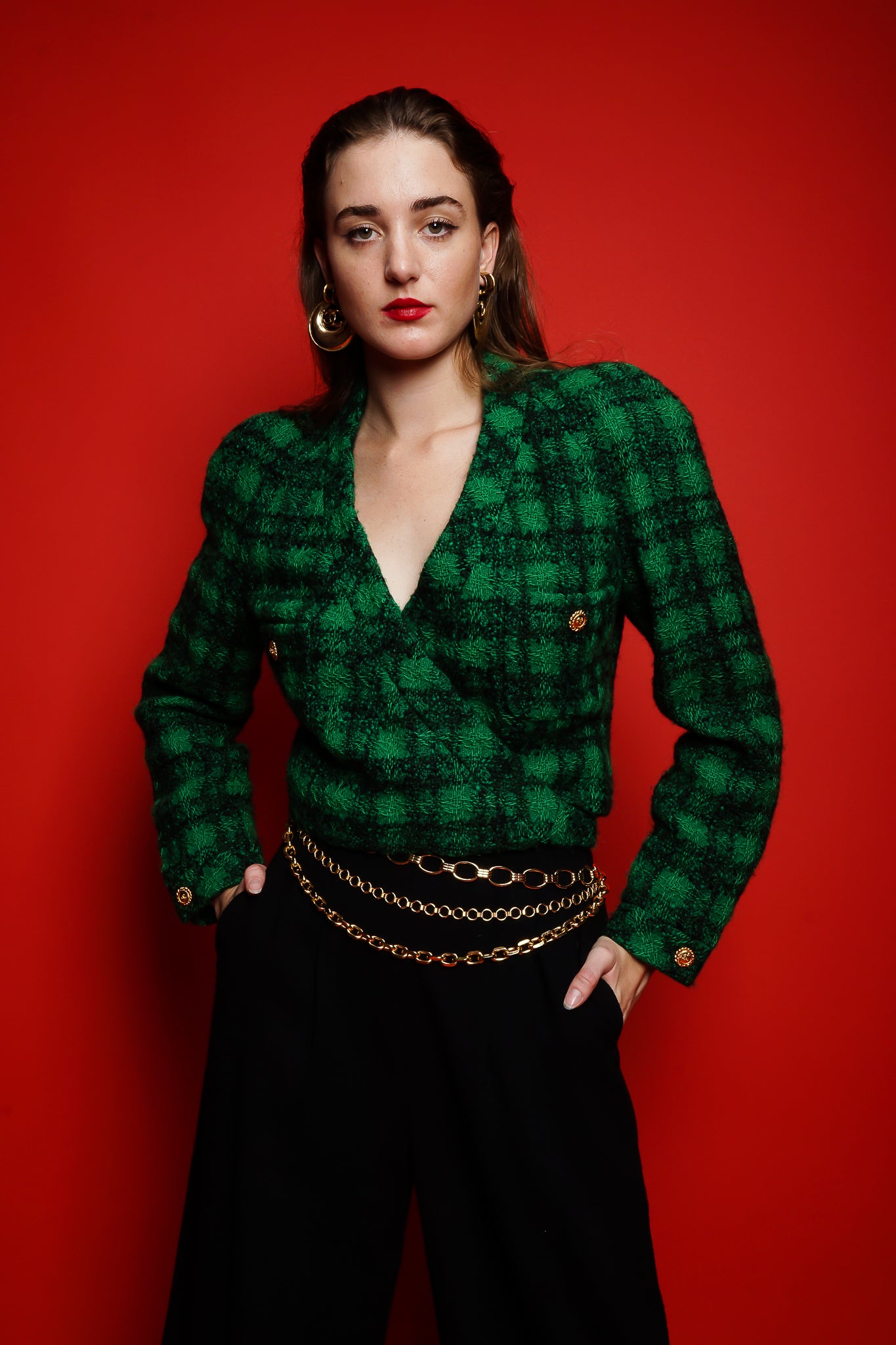 girl in Vintage Chanel Bouclé Plaid Tweed Wrap Jacket & chain belt on red at Recess Los Angeles