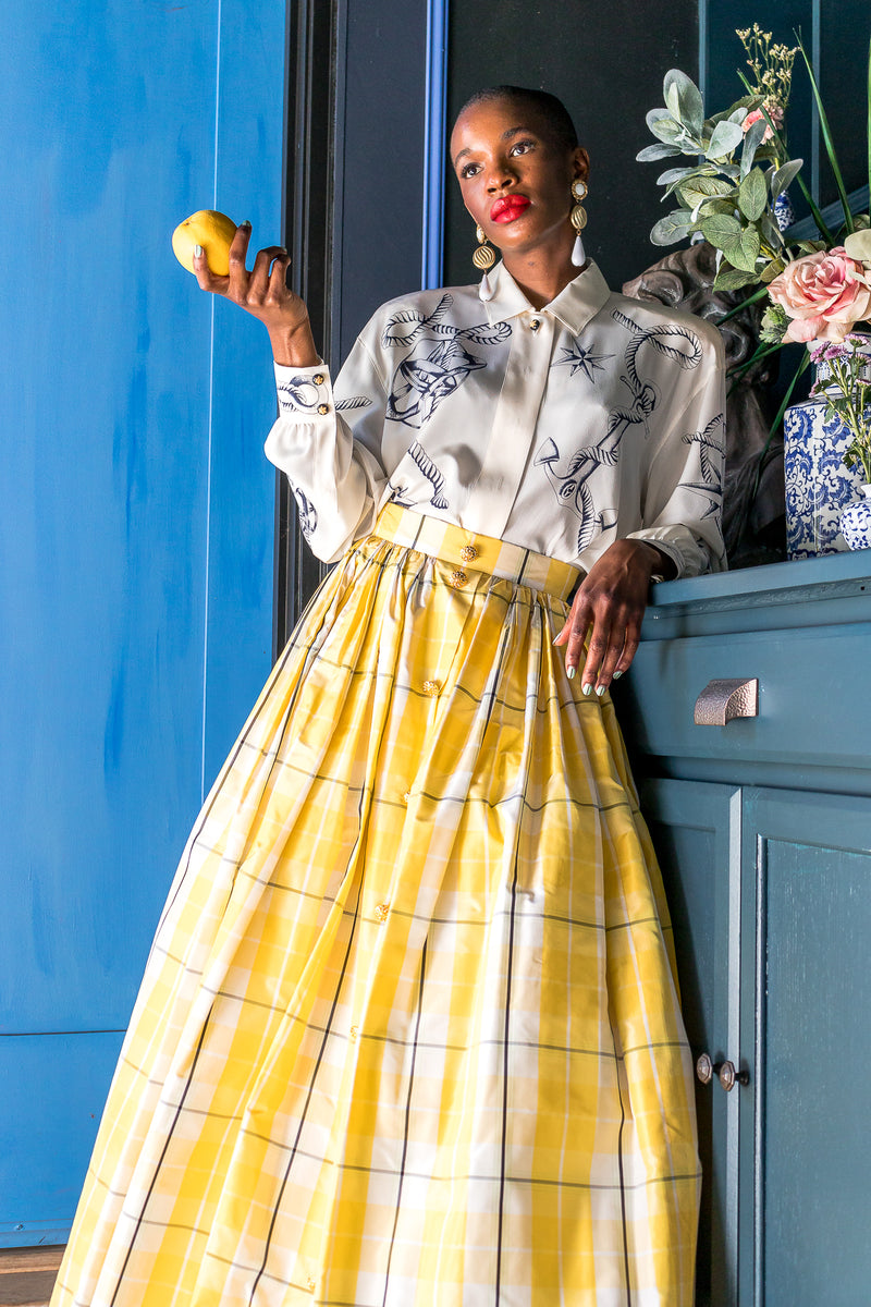 Monica Ahanonu in Vintage Escada Plaid Taffeta Ball Skirt with blue door at Recess Los Angeles