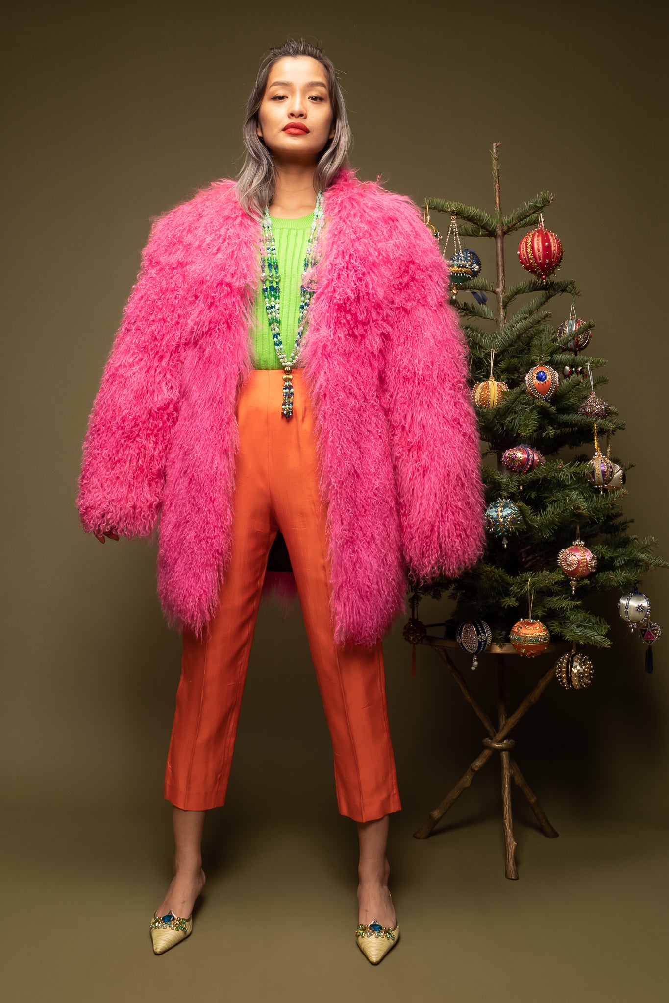 girl in Vintage Krizia Pink Mongolian Fur Coat w/ Escada top & Orange pant on olive @ Recess LA