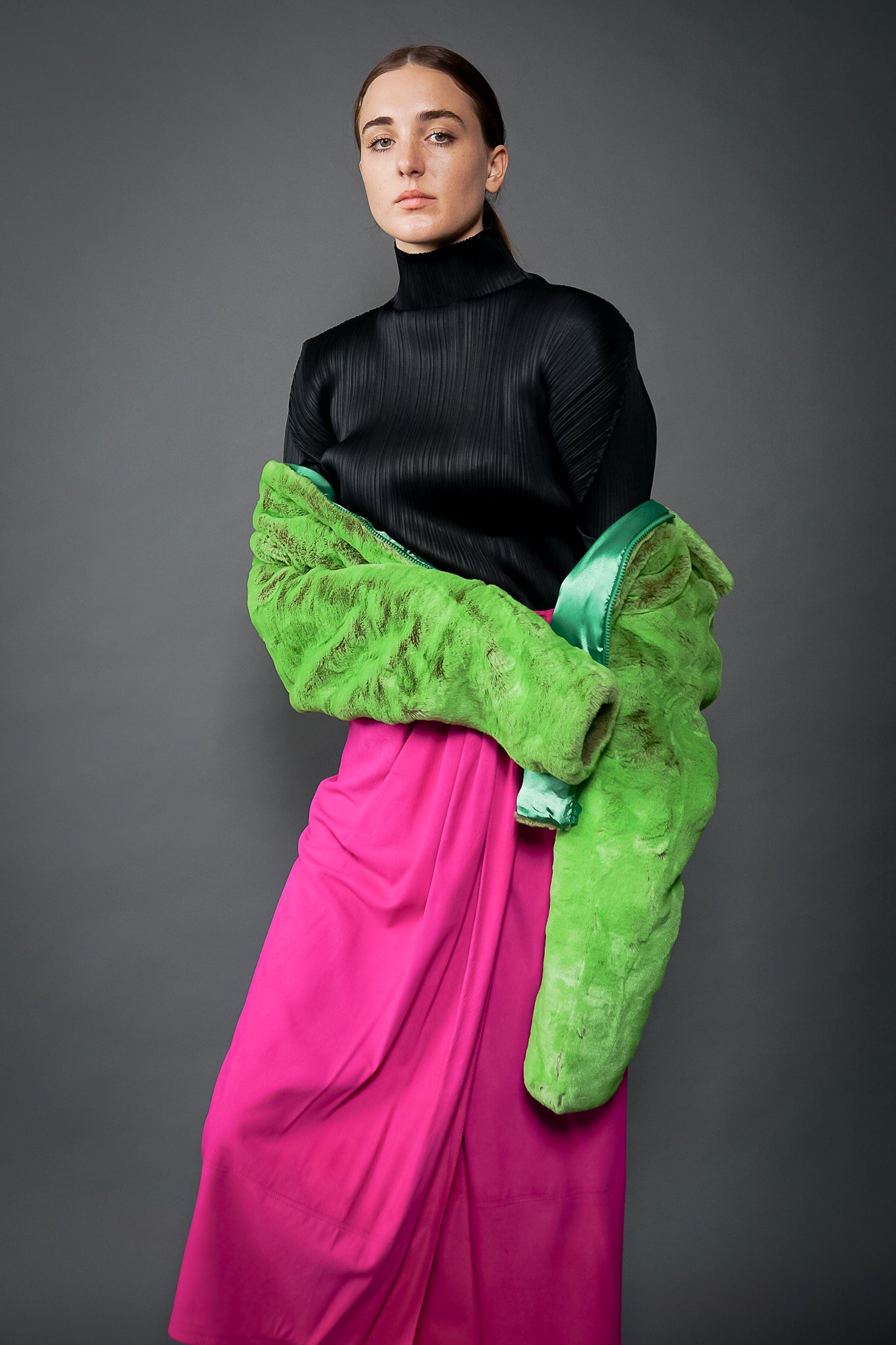 Girl in Vintage Issey Miyake Pleats Please Pleated Turtleneck Top & lime faux fur at Recess LA