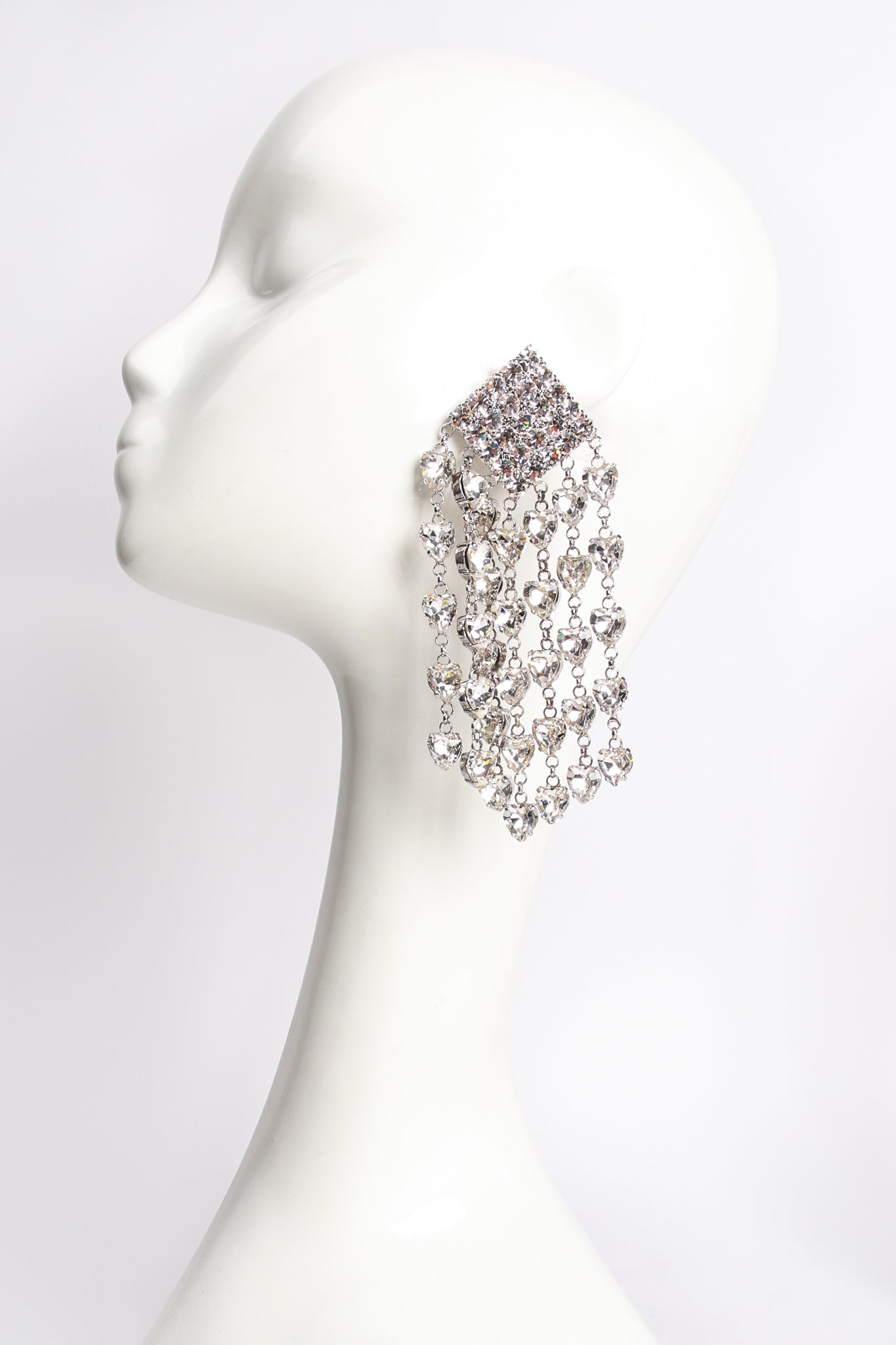 Alessandra Rich Large Crystal Heart Fringe Earrings on mannequin at Recess Los Angeles