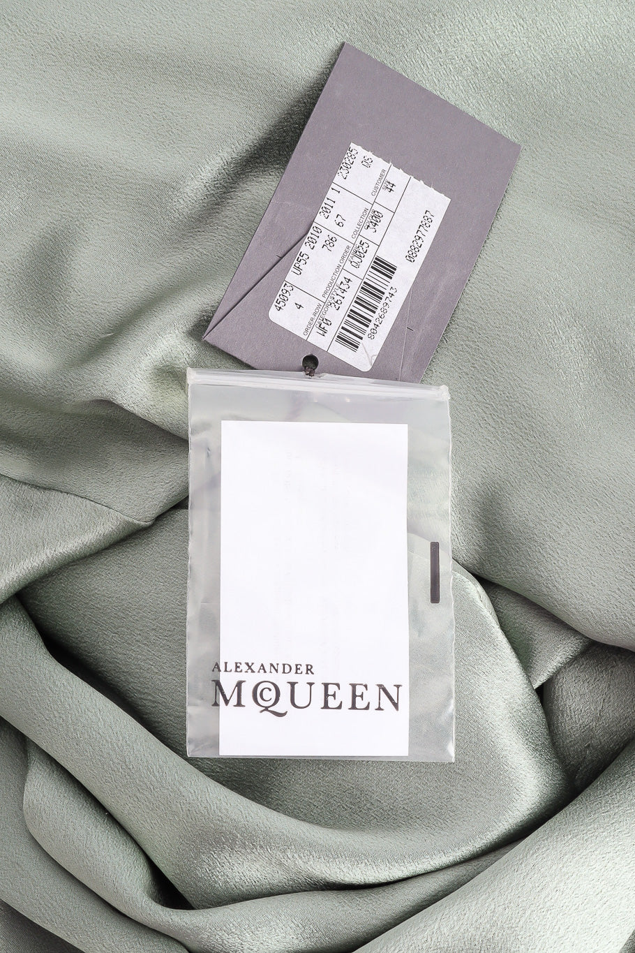 Gown with sweep train by Alexander McQueen paper tags @recessla