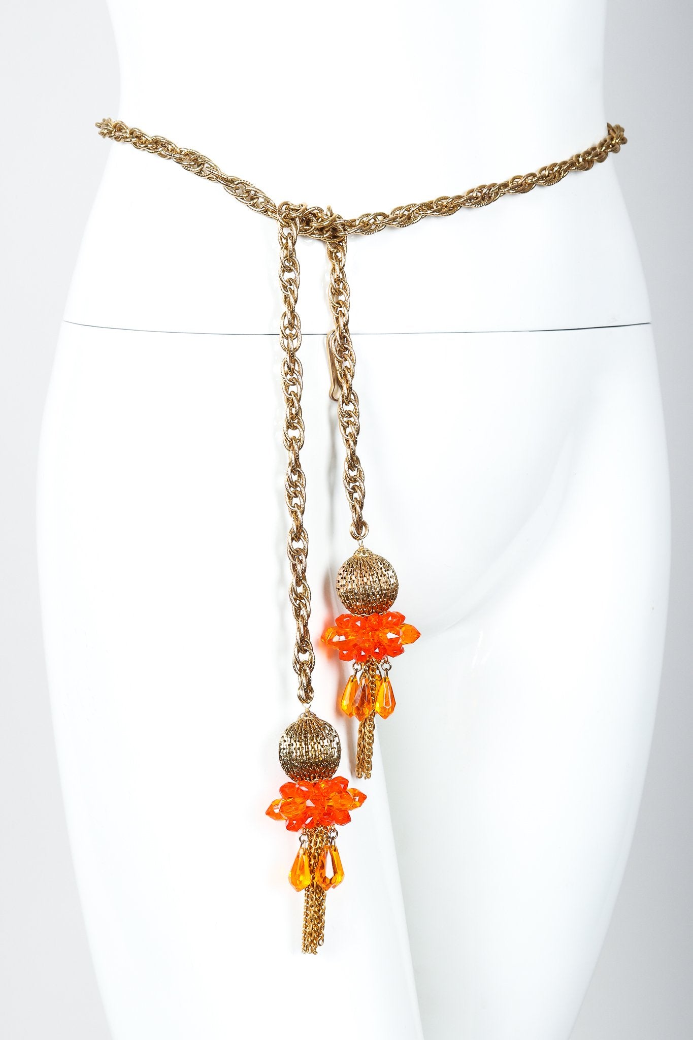 Vintage Unsigned Fiery Orange Beaded Tassel Wrap Necklace Belt on Mannequin waist at Recess