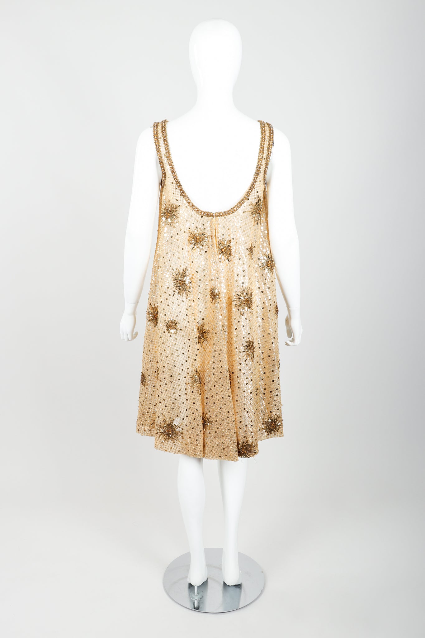 Vintage British Crown Colony Beaded Sunburst Swing Dress on Mannequin Back at Recess LA
