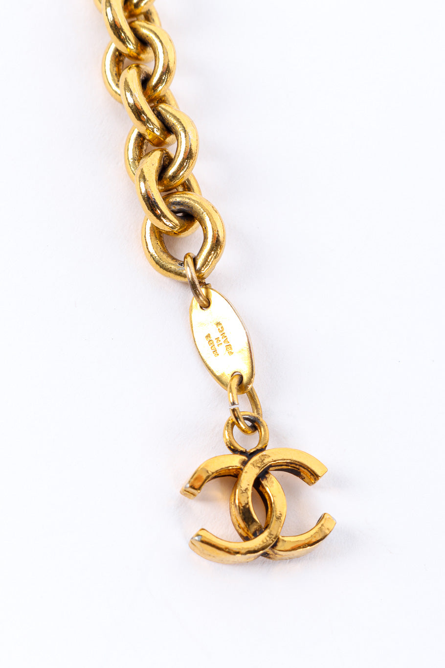 Medallion chain drop belt by Chanel flat lay cartouche back @recessla