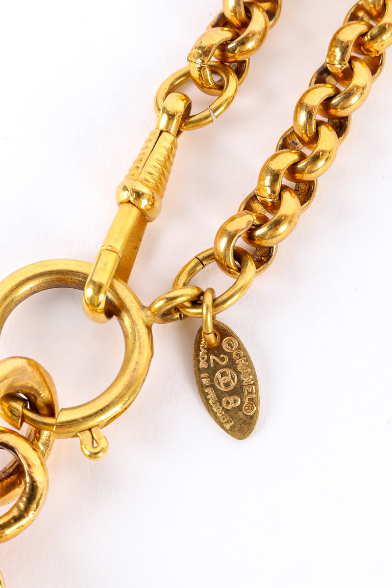 Statement gold pendant necklace by Chanel cartouche close @recessla