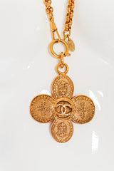 Clover Crest Cross Pendant Necklace by Chanel mannequin front @recessla