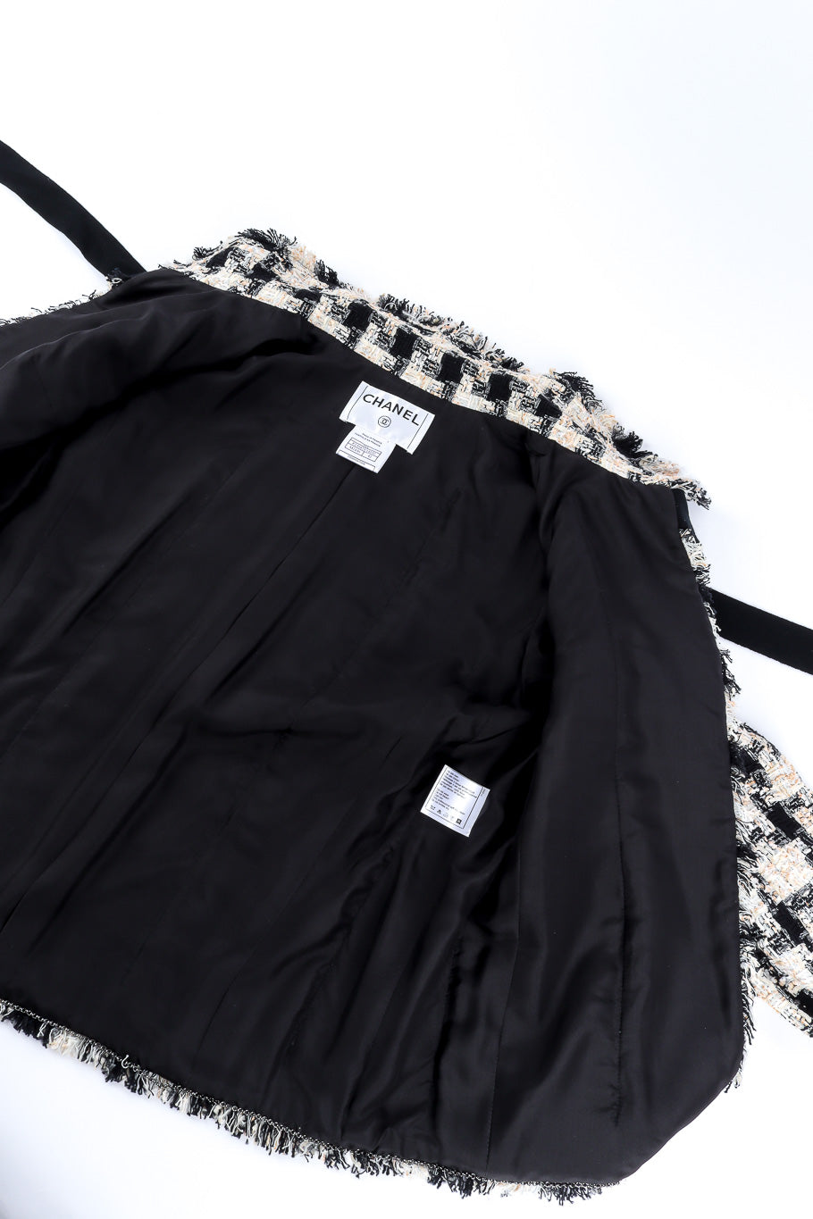 Bouclé check jacket by Chanel flat lay open @recessla