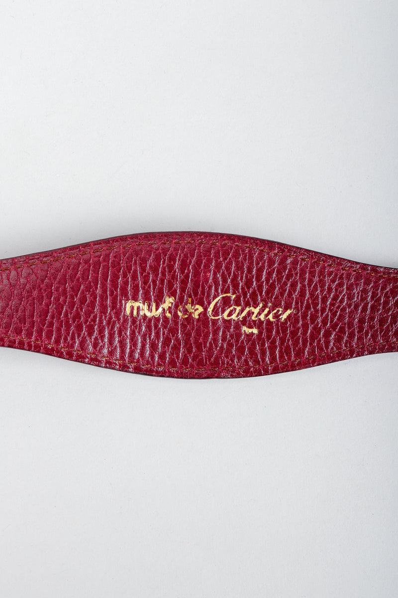 Vintage Cartier Gold Signature stamp on oxblood leather