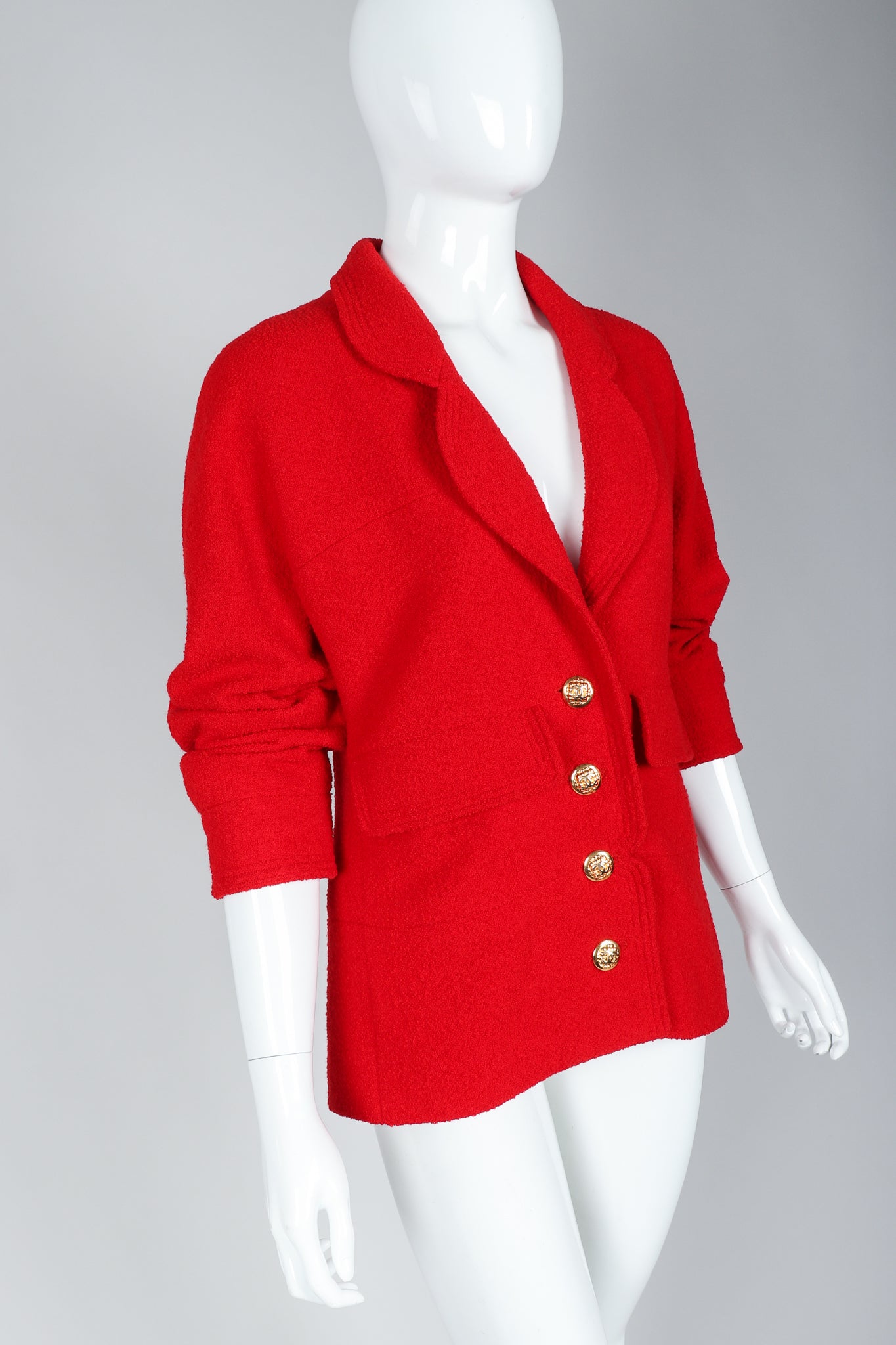 Recess Vintage Chanel Red Curved Lapel Bouclé Jacket on Mannequin, Sleeves Pushed Up