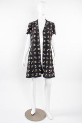 Vintage Chanel 1997 Cruise Bow Butterfly CC Logo Print Dress on mannequin open @ Recess LA