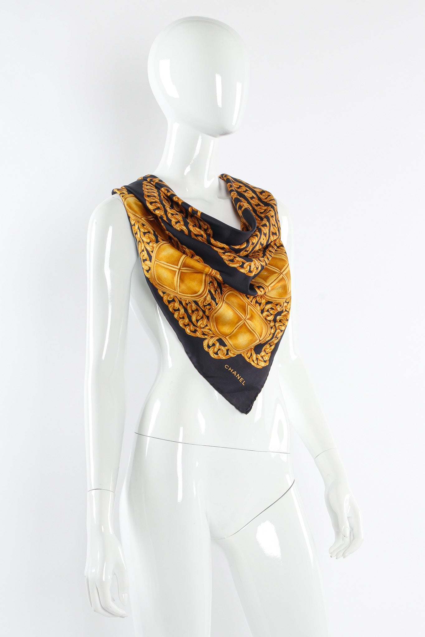 Classic chain and stud print scarf by Chanel on mannequin @recessla