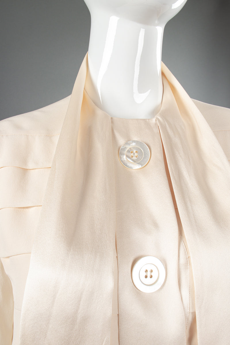 Vintage Chanel Cream Silk Panel Tuck Bow Blouse on Mannequin tie detail at Recess Los Angeles