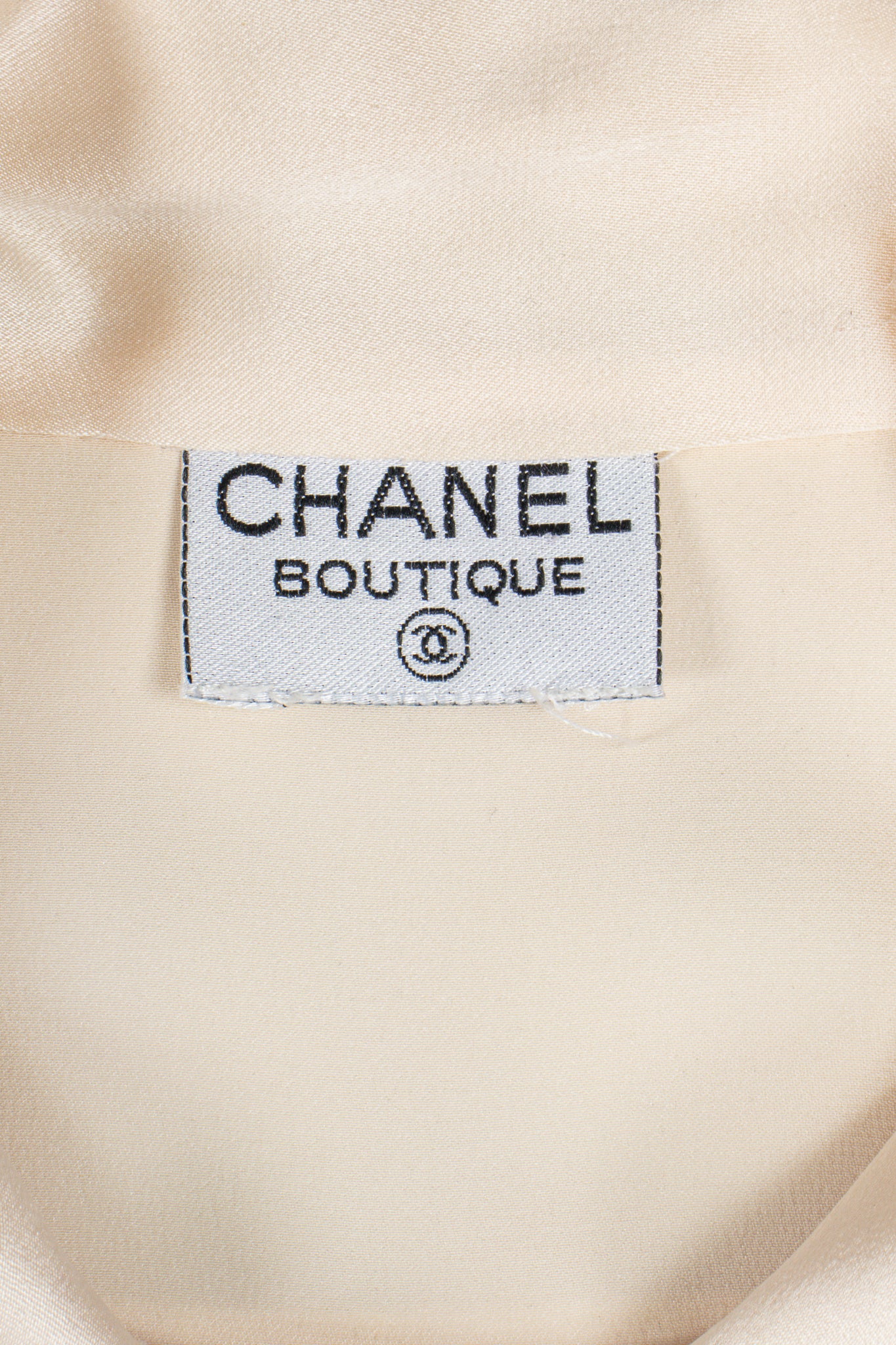 Vintage Chanel Cream Silk Panel Tuck Bow Blouse label at Recess Los Angeles
