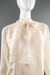 Vintage Chanel Cream Silk Panel Tuck Bow Blouse on Mannequin front crop at Recess Los Angeles