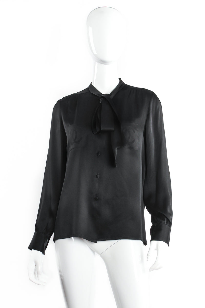 Vintage Chanel CC Pocket Black Silk Tie Neck Blouse on mannequin front at Recess Los Angeles