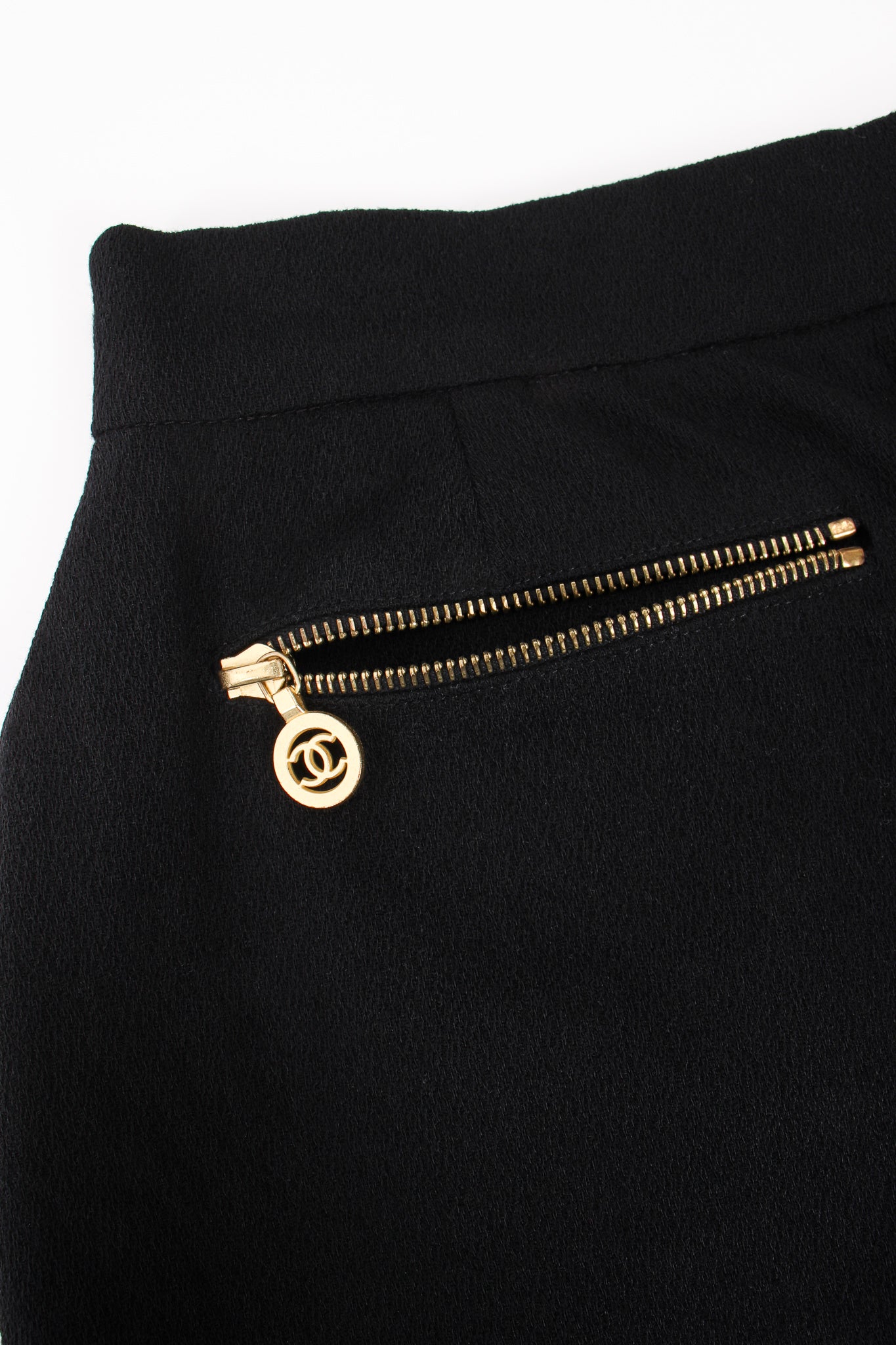 Vintage Chanel CC Logo Zipper Boucle Midi Skirt zipper detail at Recess Los Angeles