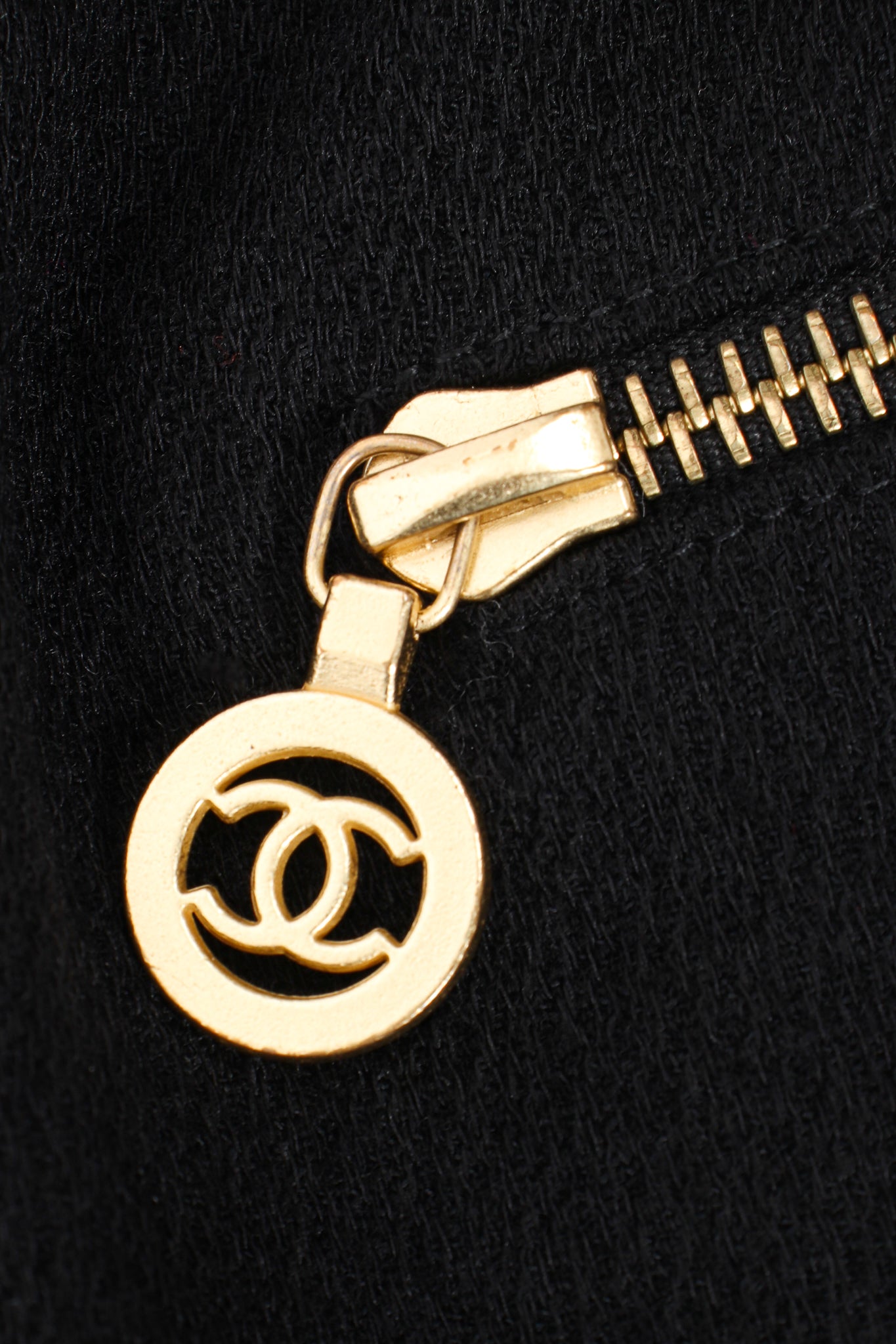 Vintage Chanel CC Logo Zipper Boucle Midi Skirt zipper pull at Recess Los Angeles