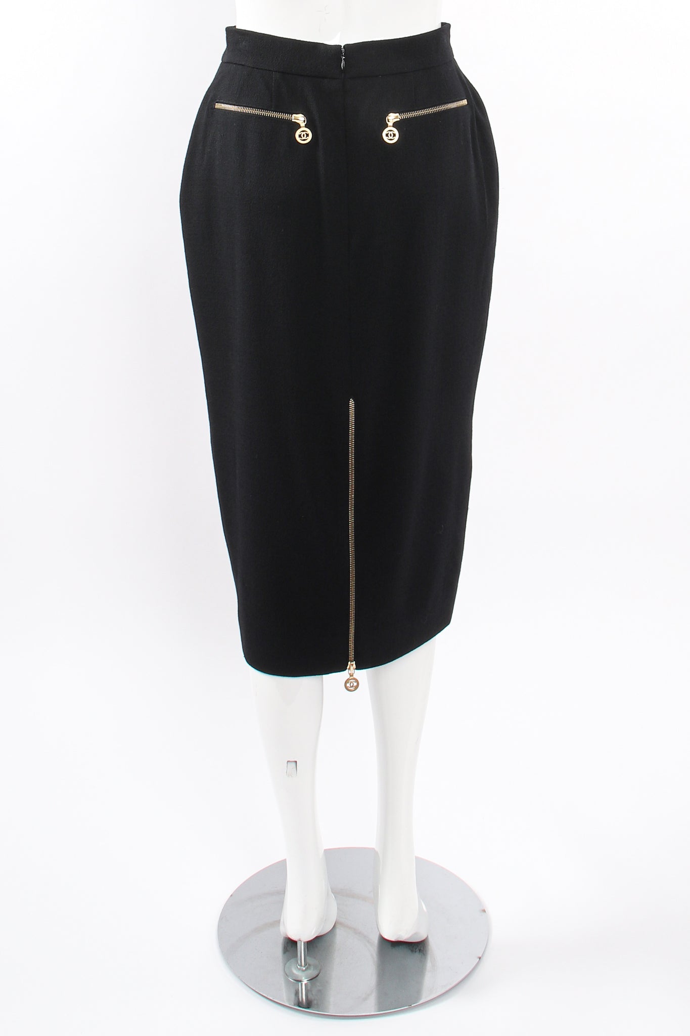 Vintage Chanel CC Logo Zipper Boucle Midi Skirt on Mannequin back at Recess Los Angeles