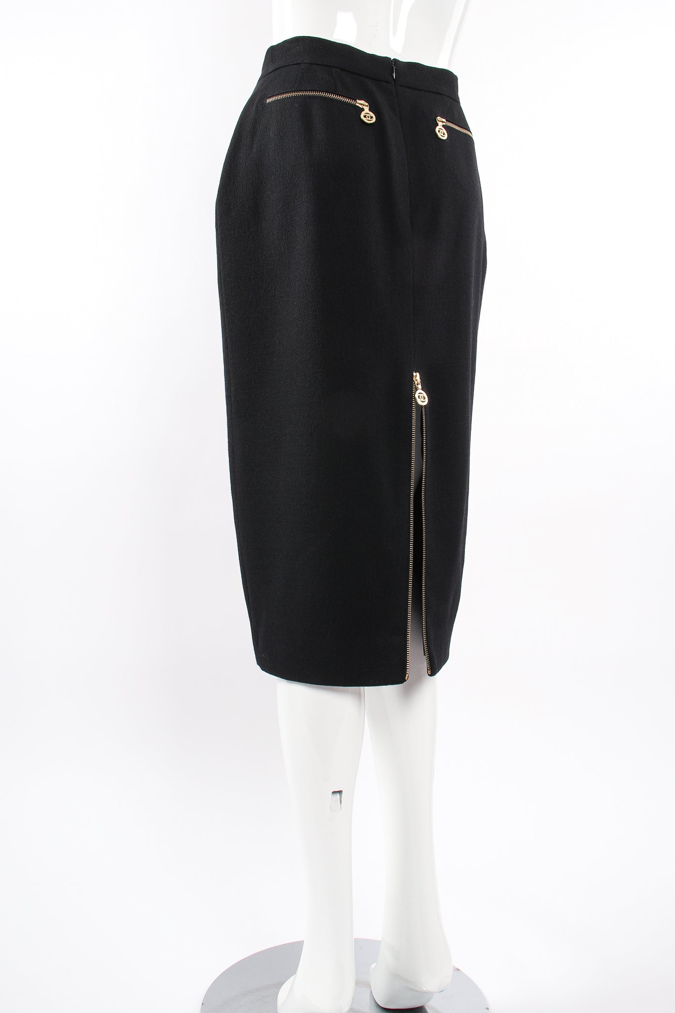 Vintage Chanel CC Logo Zipper Boucle Midi Skirt on Mannequin back angle at Recess Los Angeles