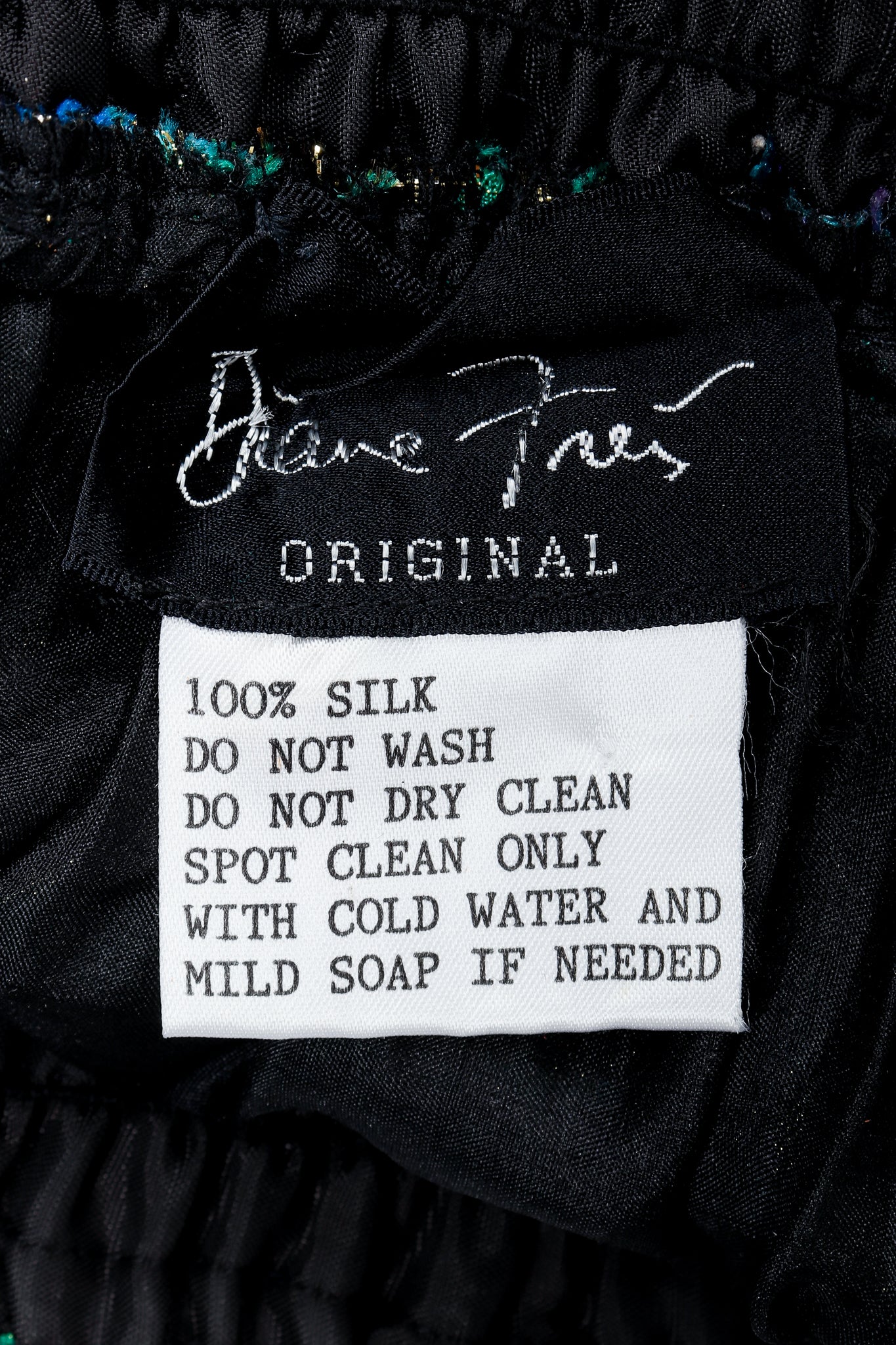 Vintage Diane Freis label on black lining fabric