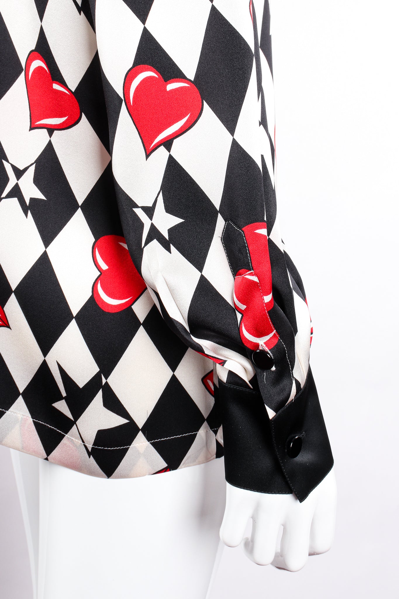 Vintage Escada Harlequin Hearts & Bows Silk Shirt on Mannequin sleeve cuff at Recess Los Angeles