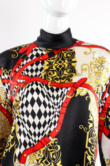 Vintage Escada Baroque Belt Print Mock Neck Blouse on mannequin neck at Recess Los Angeles