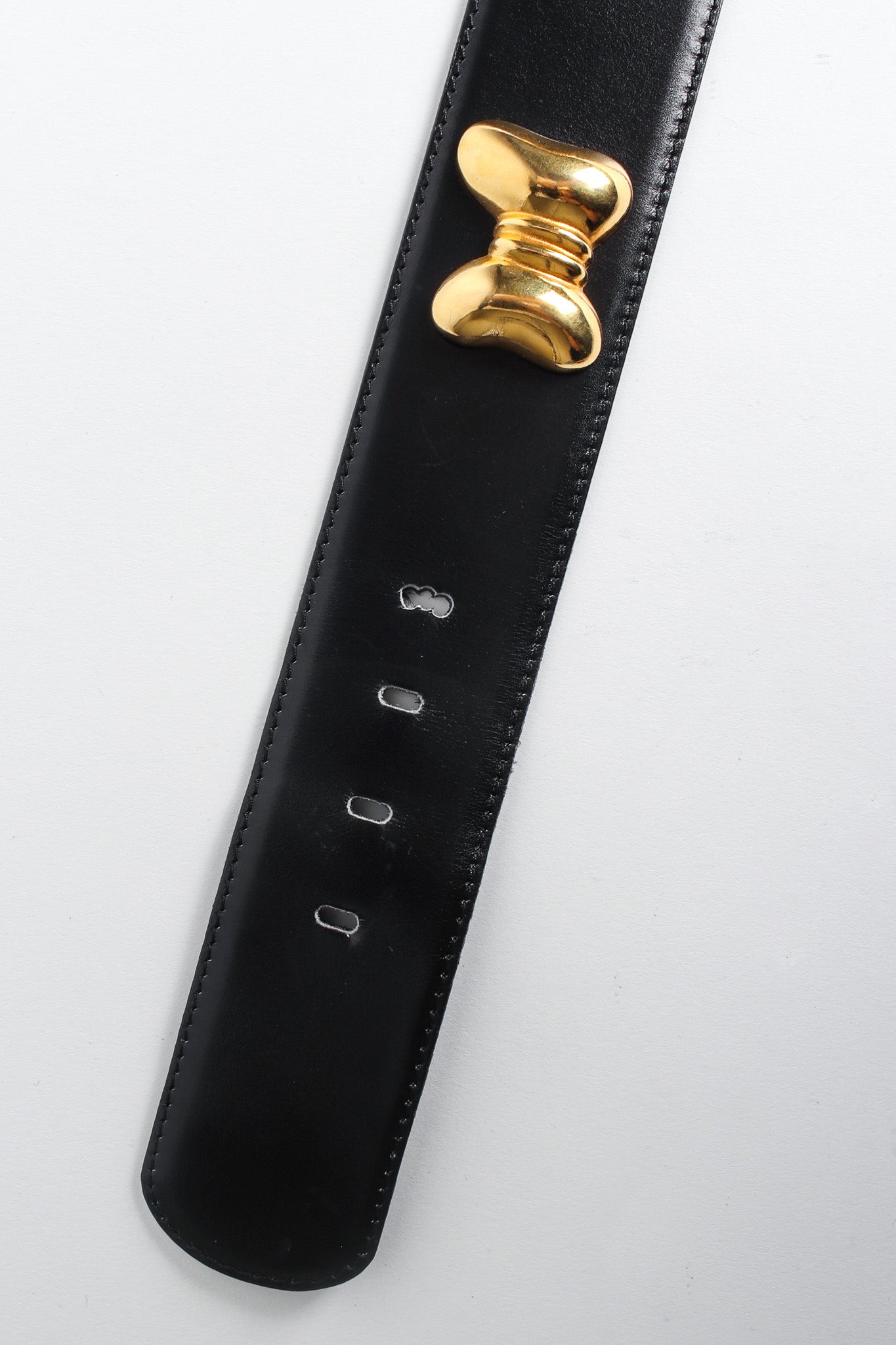 Wide black leather belt with gold bow studs by Escada tail front @recessla