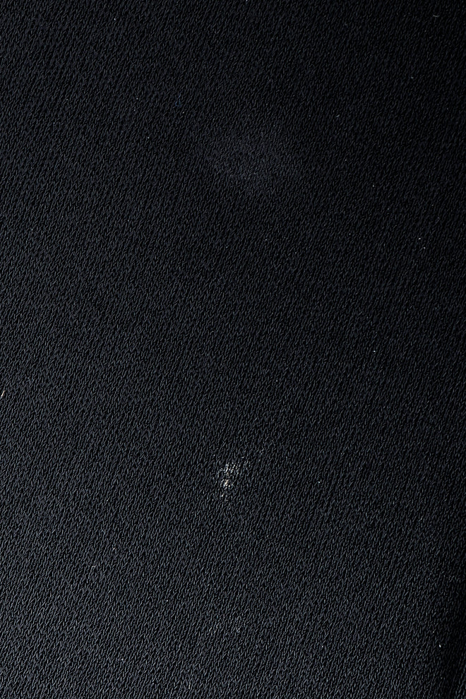 Vintage Felix Arbeo stain on fabric near hem